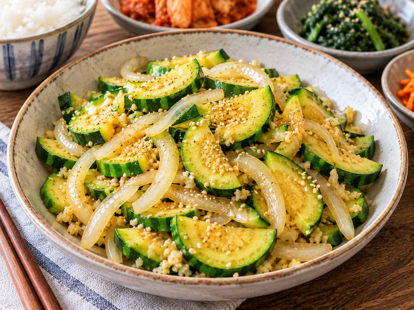 Korean zucchini recipe hobak bokkeum with tender zucchini, onion, garlic, sesame oil, and sesame seeds